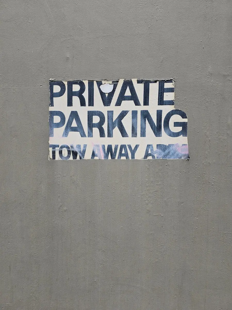 A painted sign: Private Parking.